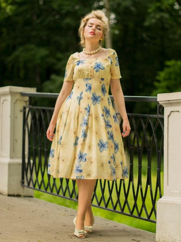 Gelbes 50er Jahre Swingkleid mit floraler Spitze